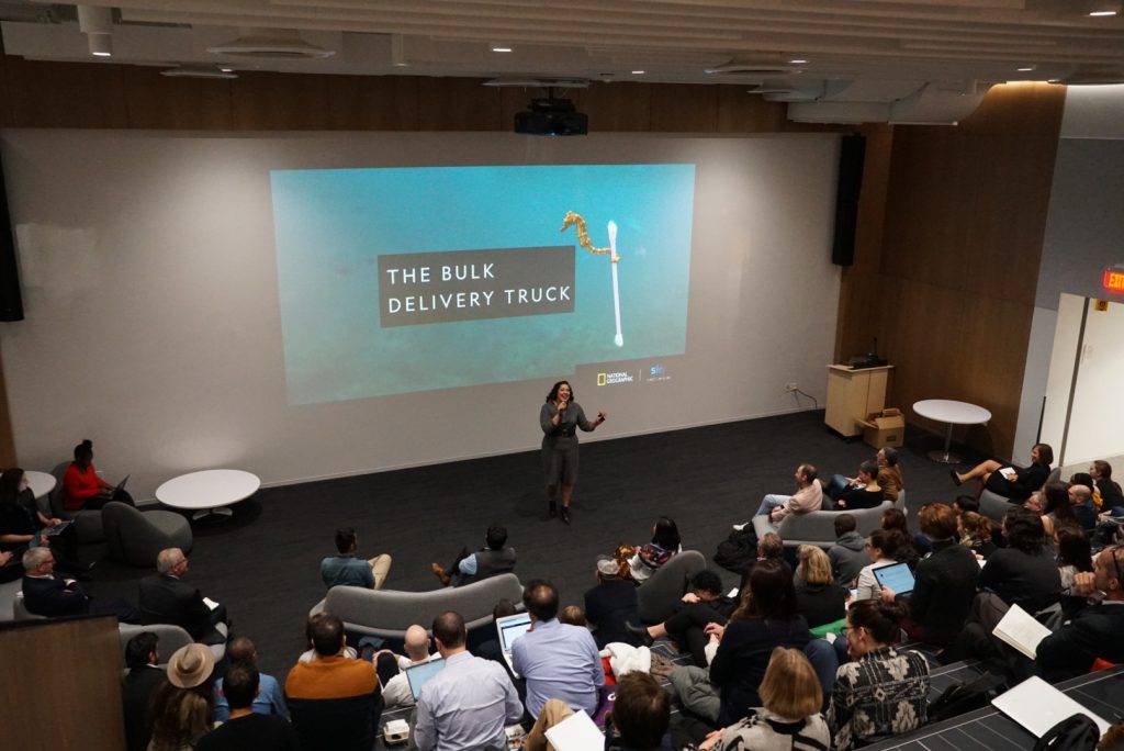 Felicia speaking in front of a crowd